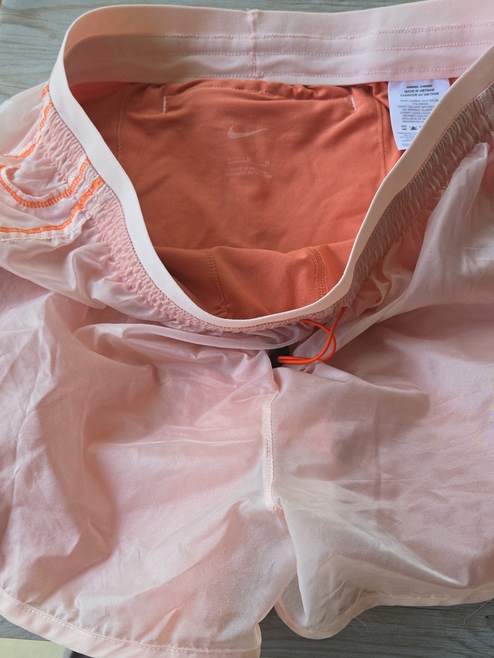 Nike Women’s Peach Pink Running Shorts with Orange Liner